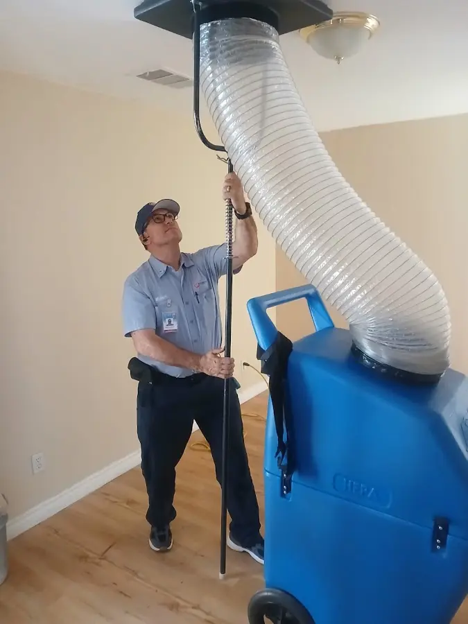 Furnace Tune-Up technician using HEPA equipment in Pasadena